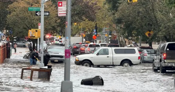 Vehicles move through floodwater in New York City, U.S. October 30, 2025, in this still image obtained from social media video. Mariah Whitmoyer/via REUTERS THIS IMAGE HAS BEEN SUPPLIED BY A THIRD PARTY. MANDATORY CREDIT. NO RESALES. NO ARCHIVES. VERIFICATION: - Location verified by road layout, street signage, buildings' facades and trees that matched file & satellite imagery. Coordinates included in original file metadata - Date verified by original file metadata/Mariah Whitmoyer