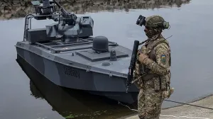 A serviceman of Ukraine's Security Service (SBU) stands guard near the latest version of its "sea baby" naval drone, amid Russia's attack on Ukraine, in an undisclosed location in Ukraine October 17, 2025. REUTERS/Vlad Smilianets/Vlad Smilianets