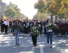 People carry flowers and banners as they gather to mark the first anniversary of the fatal November 2024 Novi Sad railway station canopy collapse, which killed 16 people, triggering nationwide accusations of widespread corruption and negligence, in Novi Sad, Serbia, November 1, 2025. REUTERS/Djordje Kojadinovic/Djordje Kojadinovic