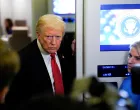 U.S. President Donald Trump looks on as he speaks to members of the media on board Air Force One en route to Joint Base Andrews, U.S., November 2, 2025. REUTERS/Elizabeth Frantz/Elizabeth Frantz