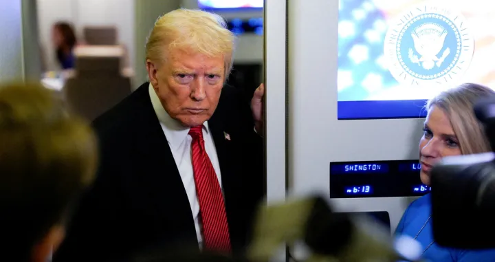 U.S. President Donald Trump looks on as he speaks to members of the media on board Air Force One en route to Joint Base Andrews, U.S., November 2, 2025. REUTERS/Elizabeth Frantz/Elizabeth Frantz