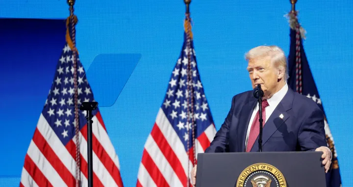 U.S. President Donald Trump looks on as he delivers remarks at the America Business Forum in Miami, Florida, U.S., November 5, 2025. REUTERS/Marco Bello/Marco Bello