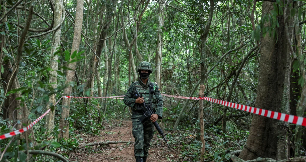 FILE PHOTO: Person from Thai military walks near Thai-Cambodian border at Chong Chub Ta Mok area, where landmines were found deployed, following a ceasefire between Cambodia and Thailand, in Surin Province, Thailand, August 20, 2025. REUTERS/Chalinee Thirasupa/File Photo/Chalinee Thirasupa