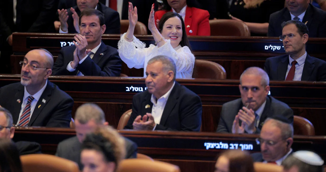 JERUSALEM - OCTOBER 13: Members of the Knesset applaud as U.S. President Donald Trump addresses the Knesset, Israel's parliament, on October 13, 2025 in Jerusalem. Chip Somodevilla/Pool via REUTERS/Chip Somodevilla