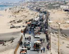 Palestinians, who were displaced to the southern part of Gaza at Israel's order during the war, make their way along a road as they return to the north, amid a ceasefire between Israel and Hamas in Gaza, in the central Gaza Strip, October 12, 2025. REUTERS/Mahmoud Issa/Mahmoud Issa