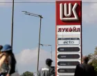 FILE PHOTO: People walk near a Lukoil gas station in Sofia, Bulgaria, October 23, 2025. REUTERS/Stoyan Nenov/File Photo/Stoyan Nenov