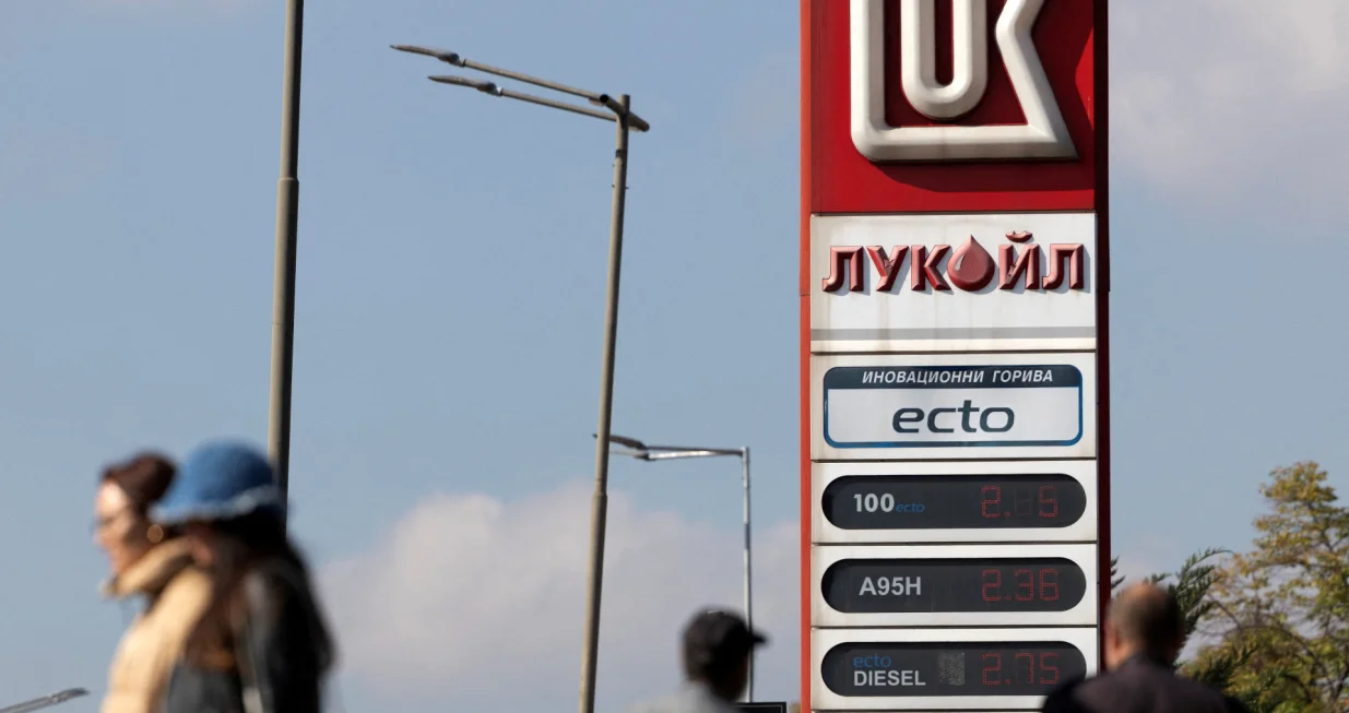 FILE PHOTO: People walk near a Lukoil gas station in Sofia, Bulgaria, October 23, 2025. REUTERS/Stoyan Nenov/File Photo/Stoyan Nenov