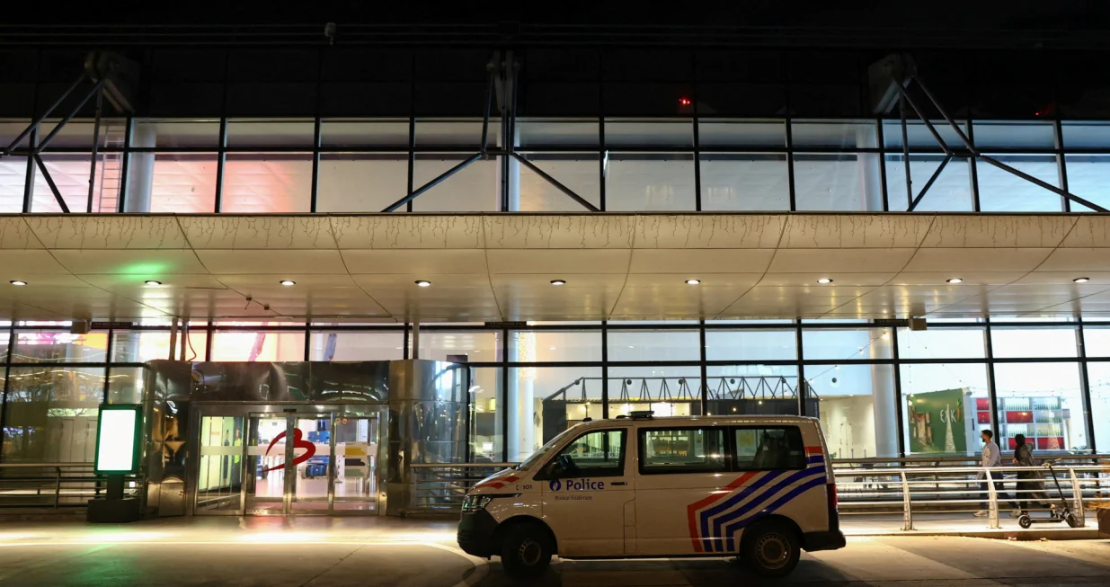 FILE PHOTO: A police vehicle is parked outside the Brussels Airport after the Belgian air traffic control service reported a sighting of a drone, in Zaventem, Belgium, November 4, 2025. REUTERS/Yves Herman/File Photo/Yves Herman