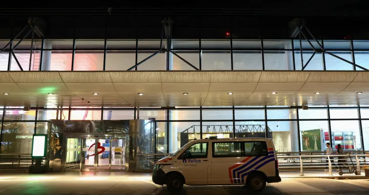 FILE PHOTO: A police vehicle is parked outside the Brussels Airport after the Belgian air traffic control service reported a sighting of a drone, in Zaventem, Belgium, November 4, 2025. REUTERS/Yves Herman/File Photo/Yves Herman