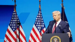 U.S. President Donald Trump looks on as he delivers remarks at the America Business Forum in Miami, Florida, U.S., November 5, 2025. REUTERS/Marco Bello/Marco Bello