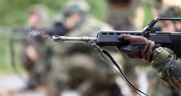 A recruit shoots his G-36 rifle at live-fire training during a media day at the Reconnaissance Battalion, as the German army showcases its new six-month basic training program designed to prepare soldiers for homeland defence and NATO operations, in Ahlen, Germany, November 13, 2025. REUTERS/Leon Kuegeler/Leon Kuegeler