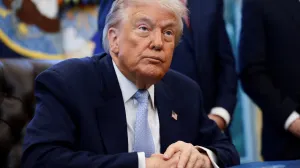 FILE PHOTO: U.S. President Donald Trump looks on as he meets with the White House Task Force on the FIFA World Cup 2026 in the Oval Office at the White House in Washington, D.C., U.S., November 17, 2025. REUTERS/Evelyn Hockstein/File Photo/Evelyn Hockstein