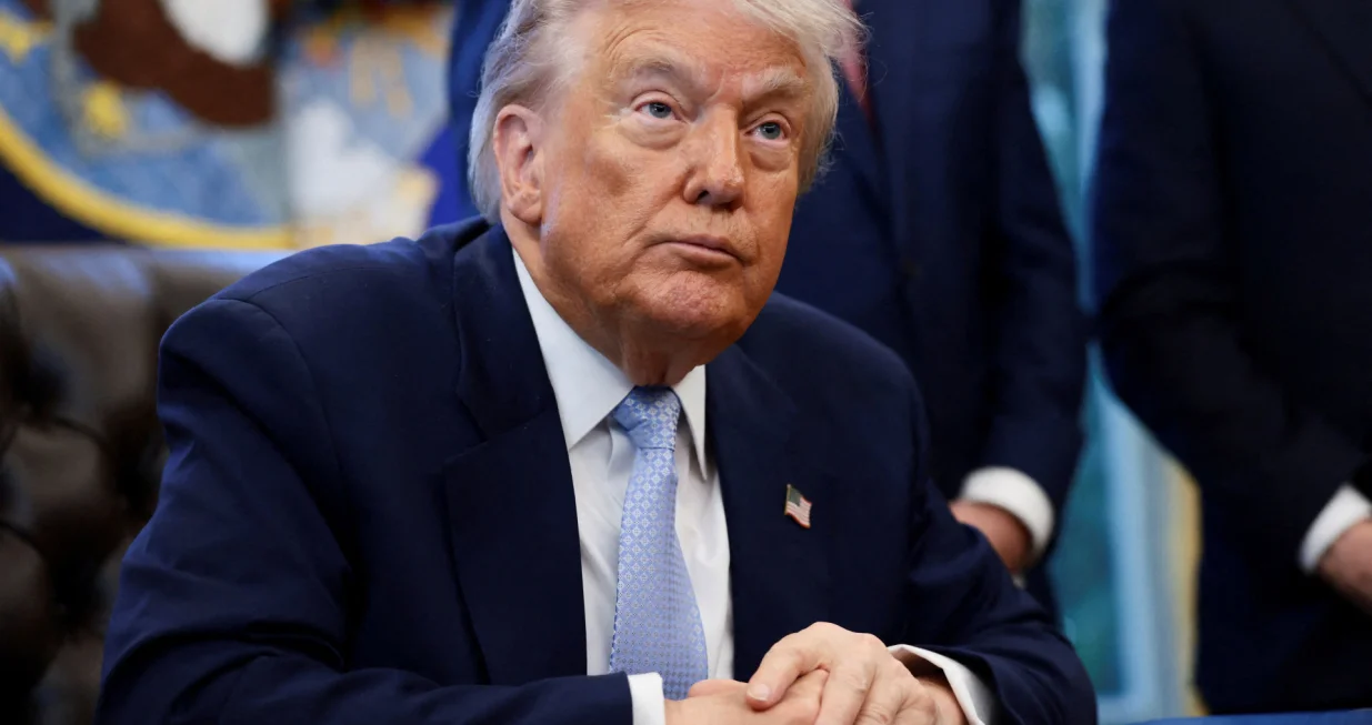 FILE PHOTO: U.S. President Donald Trump looks on as he meets with the White House Task Force on the FIFA World Cup 2026 in the Oval Office at the White House in Washington, D.C., U.S., November 17, 2025. REUTERS/Evelyn Hockstein/File Photo/Evelyn Hockstein