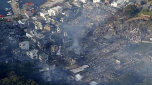 Smoke rises from a site where a massive fire blazed through more than 170 buildings, as seen from a helicopter, in Oita, Oita Prefecture, southwestern Japan, November 19, 2025, in this photo taken by Kyodo. Mandatory credit Kyodo/via REUTERS ATTENTION EDITORS - THIS IMAGE HAS BEEN SUPPLIED BY A THIRD PARTY. MANDATORY CREDIT. JAPAN OUT. NO COMMERCIAL OR EDITORIAL SALES IN JAPAN./Kyodo