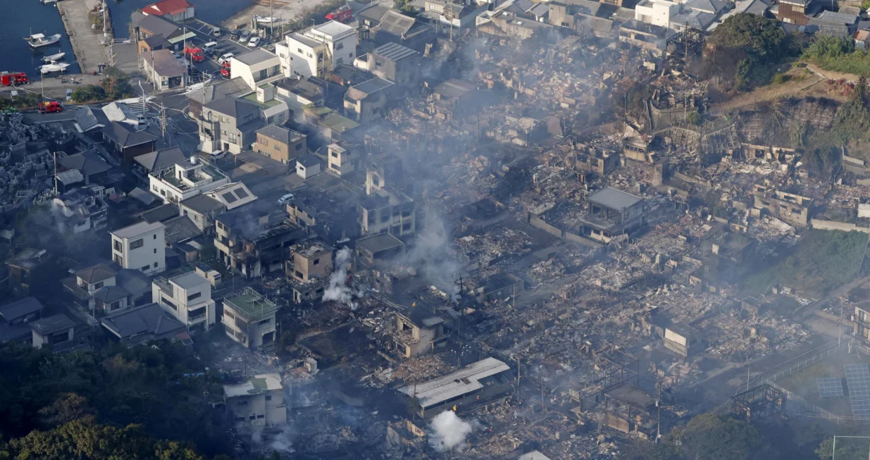 Smoke rises from a site where a massive fire blazed through more than 170 buildings, as seen from a helicopter, in Oita, Oita Prefecture, southwestern Japan, November 19, 2025, in this photo taken by Kyodo. Mandatory credit Kyodo/via REUTERS ATTENTION EDITORS - THIS IMAGE HAS BEEN SUPPLIED BY A THIRD PARTY. MANDATORY CREDIT. JAPAN OUT. NO COMMERCIAL OR EDITORIAL SALES IN JAPAN./Kyodo