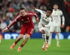 Soccer Football - UEFA Champions League - Liverpool v Real Madrid - Anfield, Liverpool, Britain - November 4, 2025 Liverpool's Florian Wirtz in action with Real Madrid's Rodrygo REUTERS/Phil Noble/Foto: Phil Noble