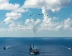 The U.S. Navy's Gerald R. Ford Carrier Strike Group, including the flagship USS Gerald R. Ford, USS Winston S. Churchill, USS Mahan and USS Bainbridge, sail towards the Caribbean Sea under F/A-18E/F Super Hornets and a U.S. Air Force B-52 Stratofortress, in the Atlantic Ocean November 13, 2025. U.S. Navy/Petty Officer 3rd Class Gladjimi Balisage/Handout via REUTERS. THIS IMAGE HAS BEEN SUPPLIED BY A THIRD PARTY/Us Navy