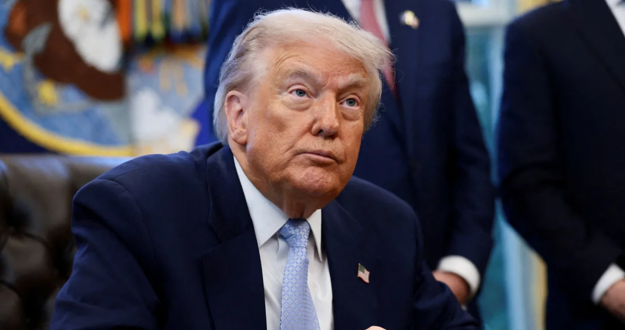FILE PHOTO: U.S. President Donald Trump looks on as he meets with the White House Task Force on the FIFA World Cup 2026 in the Oval Office at the White House in Washington, D.C., U.S., November 17, 2025. REUTERS/Evelyn Hockstein/File Photo/Evelyn Hockstein