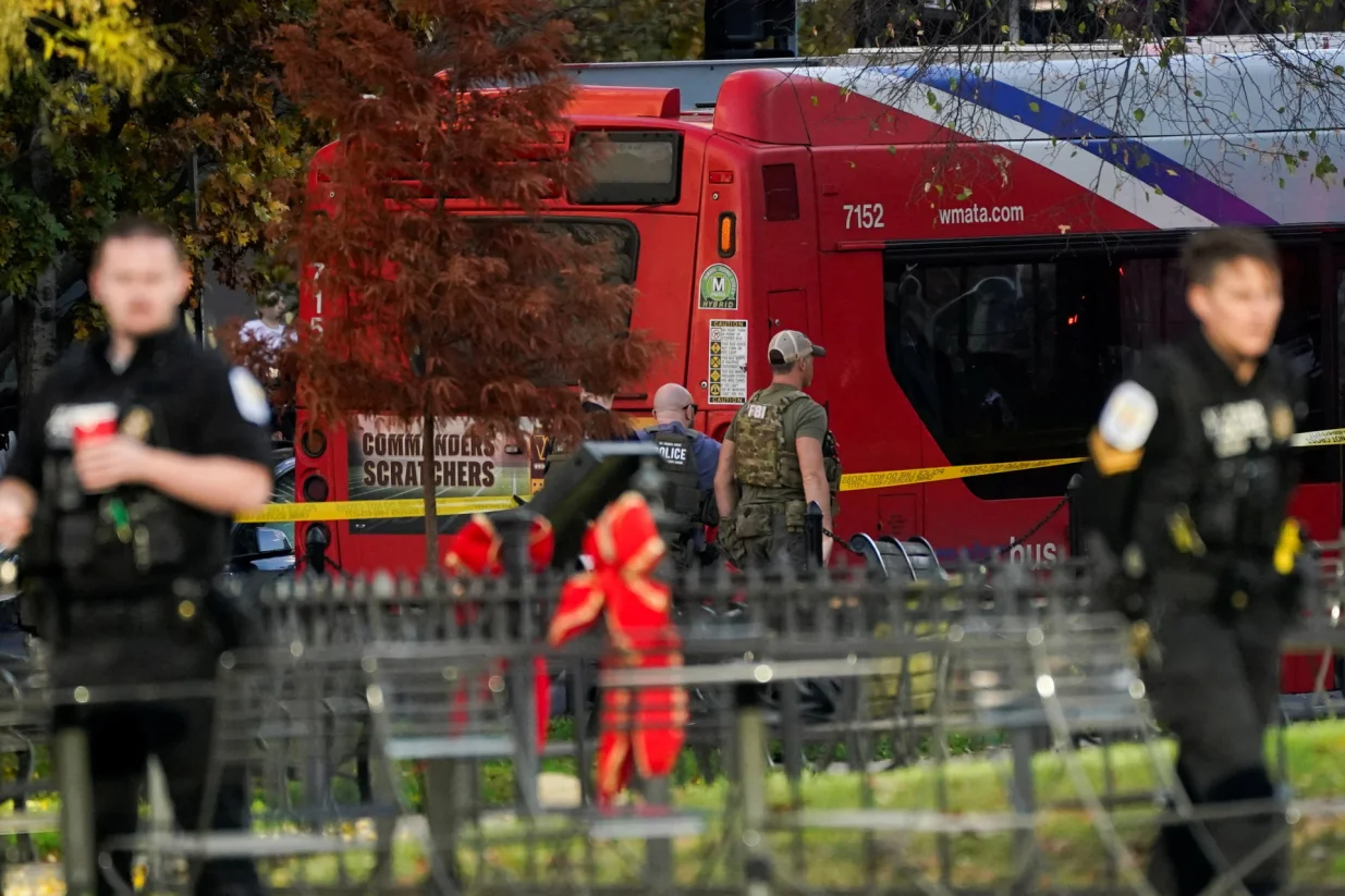 An FBI member walks in a cordoned-off area after two National Guard members were reportedly shot near the White House in Washington, D.C., U.S., November 26, 2025. REUTERS/Nathan Howard/Nathan Howard