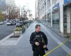 A uniformed U.S. Secret Service officer stands guard after two National Guard members were shot near the White House in Washington, D.C., U.S., November 26, 2025. REUTERS/Nathan Howard/Nathan Howard