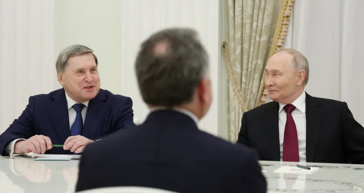 Russian President Vladimir Putin and foreign policy aide Yuri Ushakov attend a meeting with U.S. President Donald Trump's special envoy Steve Witkoff at the Kremlin in Moscow, Russia, December 2, 2025. Sputnik/Alexander Kazakov/Pool via REUTERS ATTENTION EDITORS - THIS IMAGE WAS PROVIDED BY A THIRD PARTY./Alexander Kazakov