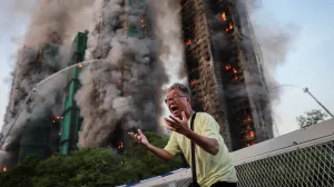 Wong, 71, reacts after saying his wife is trapped inside Wang Fuk Court during a major fire, in Tai Po, Hong Kong, China, November 26, 2025. REUTERS/Tyrone Siu   SEARCH "HONG KONG FIRE PICTURE" FOR THIS STORY. SEARCH "WIDER IMAGE" FOR ALL STORIES.  TPX IMAGES OF THE DAY/Tyrone Siu