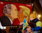 Protesters display a banner with caricatures of Russian President Vladimir Putin and U.S. President Donald Trump as people demonstrate against a plan drafted by the U.S. President Donald Trump's administration to end the war in Ukraine during a protest rally called "No to Munich 2025. Do not sell out Ukraine", in front of the U.S. Embassy in Prague, Czech Republic, November 25, 2025. REUTERS/Eva Korinkova/Eva Korinkova