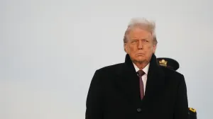 U.S. President Donald Trump participates in a dignified transfer of the remains of two Iowa National Guard members killed in Syria, Sgt. Edgar Torres Tovar and Sgt. William Howard, and Ayad Mansoor Sakat, of Macomb, Michigan, who was working as an interpreter in Syria, at Dover Air Force Base in Dover, Delaware, U.S., December, 17, 2025. REUTERS/Nathan Howard/Nathan Howard