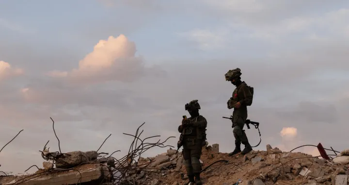 Israeli soldiers stand on rubble in Rafah in the southern Gaza Strip, December 8, 2025. REUTERS/Nir Elias REUTERS EDITOR'S NOTE: PHOTOGRAPHS WERE REVIEWED BY THE IDF AS PART OF THE CONDITIONS OF THE EMBED. NO PHOTOS WERE REMOVED/Nir Elias