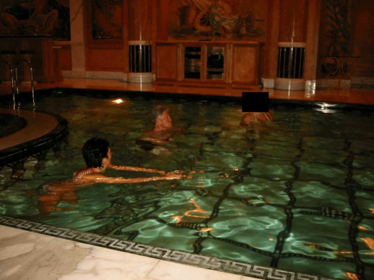 Former U.S. President Bill Clinton swims in a pool in this image released by the Department of Justice in Washington, D.C., U.S., on December 19, 2025 as part of a new trove of documents from its investigations into the late financier and convicted sex offender Jeffrey Epstein. U.S. Justice Department/Handout via REUTERS THIS IMAGE HAS BEEN SUPPLIED BY A THIRD PARTY REDACTED AREAS FROM SOURCE. THIS PICTURE WAS PROCESSED BY REUTERS TO ENHANCE QUALITY. AN UNPROCESSED VERSION HAS BEEN PROVIDED SEPARATELY./U.s. Justice Department