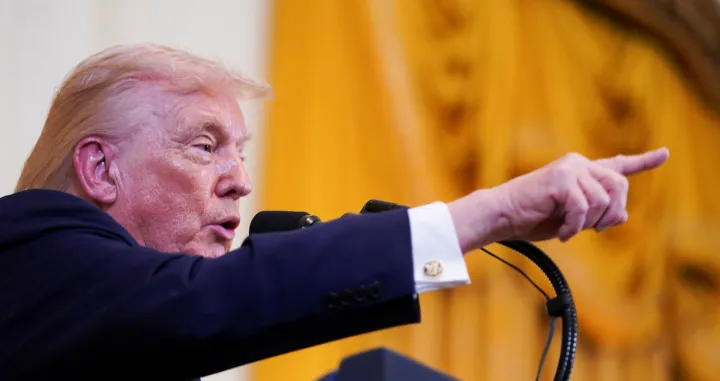 U.S. President Donald Trump gestures as he speaks at a Hanukkah reception in the East Room of the White House in Washington, D.C., U.S., December 16, 2025. REUTERS/Nathan Howard/Nathan Howard