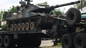 A military truck carries a tank on a road amid deadly clashes between Thailand and Cambodia along a disputed border area, in Surin province, Thailand, December 11, 2025. REUTERS/Athit Perawongmetha/Athit Perawongmetha