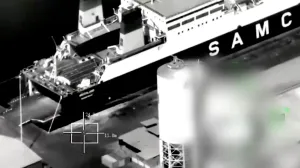 A screenshot from footage released by the Saudi-led Coalition shows what is says is the arrival of the "Greeland" ship from Al Fujairah port to Al Mukalla Port, carrying what it described as foreign military support to UAE-backed southern separatists, in Yemen's southern port of Mukalla, in this screengrab from a handout video obtained by Reuters on December 30, 2025. Saudi-led Coalition/Handout via REUTERS THIS IMAGE HAS BEEN SUPPLIED BY A THIRD PARTY. TEXT OVERLAY AND BLURRING FROM SOURCE. VERIFICATION LINES: Storage tanks, vehicles and the wall match with satellite images and corroborating footages showing the fire. Date not verified by Reuters./Saudi-led Coalition