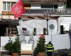 Emergency personnel work at the site of an explosion and fire at the "Le Constellation" bar, where several people died and others were injured after an explosion tore through a crowded New Year's Eve party, according to Swiss police, in the upscale ski resort of Crans-Montana in southwestern Switzerland, January 1, 2026. REUTERS/Denis Balibouse  TPX IMAGES OF THE DAY/Denis Balibouse