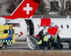 Medical staff and airport personnel load a casualty onto a Swiss Air-Ambulance plane at Sion Airport following a fire and an explosion at the "Le Constellation" bar, during a New Year's Eve party in the upscale ski resort of Crans-Montana in southwestern Switzerland, in Sion, Switzerland, January 2, 2026. REUTERS/Lisa Leutner/Lisa Leutner