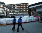 Swiss police officers walk outside the "Le Constellation" bar, after a fire and explosion during a New Year's Eve party where several people died, and others were injured, according to Swiss police, in the upscale ski resort of Crans-Montana in southwestern Switzerland, January 3, 2026. REUTERS/Denis Balibouse/Denis Balibouse