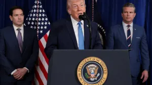 FILE PHOTO: U.S. President Donald Trump speaks as Secretary of State Marco Rubio and Secretary of Defense Pete Hegseth look on during a press conference following a U.S. strike on Venezuela where President Nicolas Maduro and his wife, Cilia Flores, were captured, from Trump's Mar-a-Lago club in Palm Beach, Florida, U.S., January 3, 2026. REUTERS/Jonathan Ernst/File Photo/Jonathan Ernst