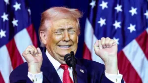U.S. President Donald Trump gestures as he makes an impression of a transgender weightlifter during his address to House Republicans at their annual issues conference retreat at the Kennedy Center, renamed the Trump-Kennedy Centre by the Trump-appointed board of directors, in Washington, D.C., U.S., January 6, 2026. REUTERS/Kevin Lamarque/Kevin Lamarque