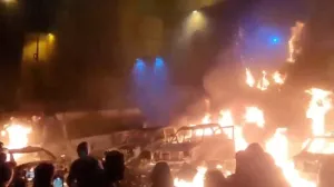Protesters gather as vehicles burn, amid evolving anti-government unrest, in Tehran, Iran, in this screen grab obtained from a social media video released on January 9, 2026. Social Media/via REUTERS THIS IMAGE HAS BEEN SUPPLIED BY A THIRD PARTY. NO RESALES. NO ARCHIVES. REFILE - QUALITY REPEAT VERIFICATION: - Buildings, business signage and traffic light matched file and satellite imagery - Date not verified - Witnesses told Reuters protesters gathered in the streets on Thursday (January 8)/Social Media