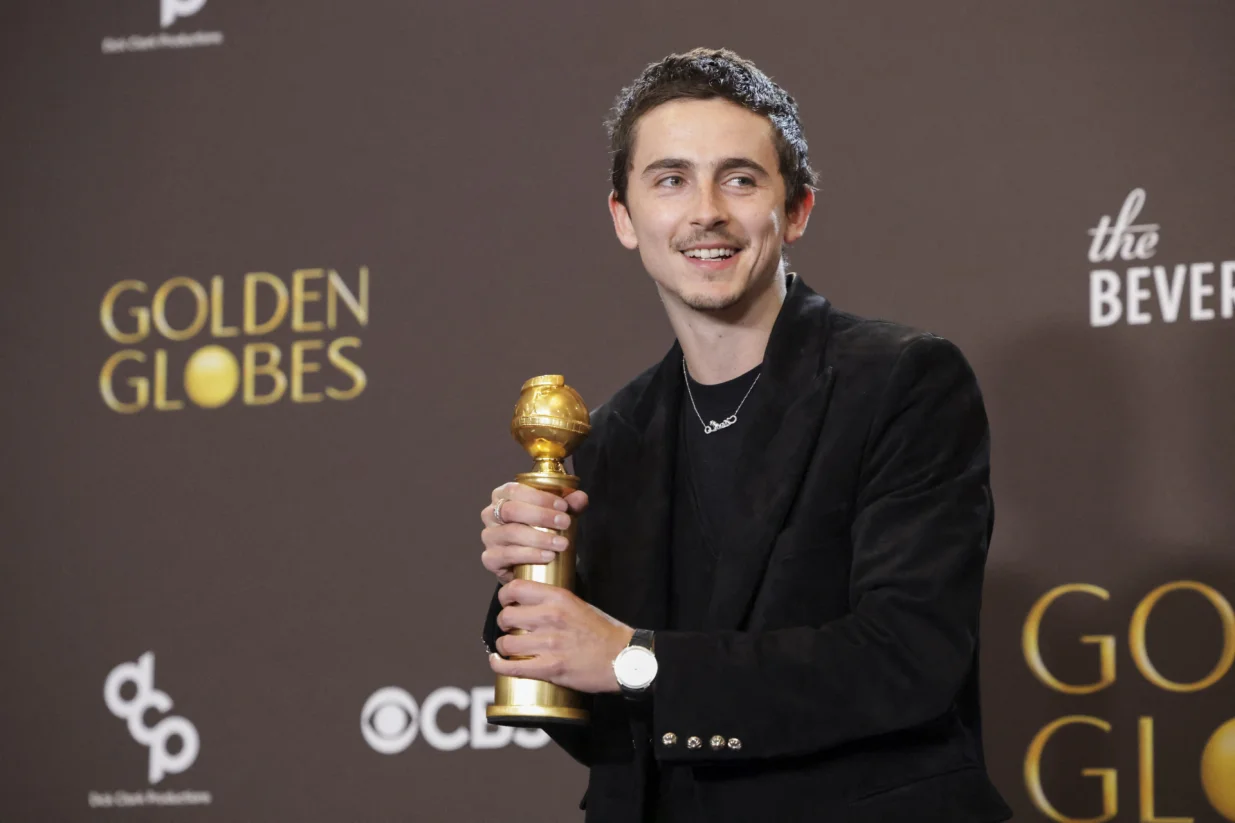 Timothee Chalamet poses with the Best Performance by a Male Actor in a Motion Picture - Musical or Comedy award for "Marty Supreme" at the 83rd Annual Golden Globes in Beverly Hills, California, U.S., January 11, 2026. REUTERS/Mario Anzuoni/Mario Anzuoni