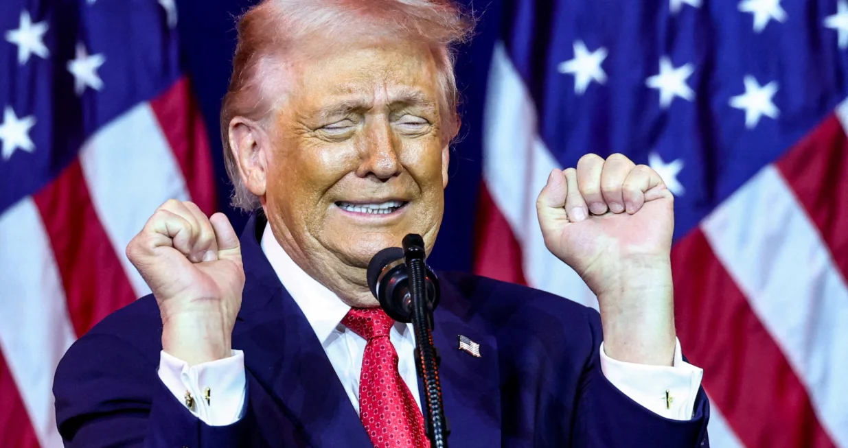U.S. President Donald Trump gestures as he makes an impression of a transgender weightlifter during his address to House Republicans at their annual issues conference retreat at the Kennedy Center, renamed the Trump-Kennedy Centre by the Trump-appointed board of directors, in Washington, D.C., U.S., January 6, 2026. REUTERS/Kevin Lamarque/Kevin Lamarque