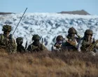 FILE PHOTO: Members of the Danish armed forces practice looking for potential threats during a military drill as Danish, Swedish and Norwegian home guard units together with Danish, German and French troops take part in joint military drills in Kangerlussuaq, Greenland, September 17, 2025. REUTERS/Guglielmo Mangiapane/File Photo/Guglielmo Mangiapane