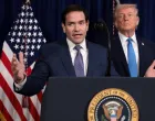 U.S. Secretary of State Marco Rubio speaks as U.S. President Donald Trump stands behind him during a press conference following a U.S. strike on Venezuela where President Nicolas Maduro and his wife, Cilia Flores, were captured, from Trump's Mar-a-Lago club in Palm Beach, Florida, U.S., January 3, 2026. REUTERS/Jonathan Ernst/Jonathan Ernst