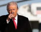 U.S. President Donald Trump gestures, before boarding Air Force One en route to Detroit, Michigan, at Joint Base Andrews, Maryland, U.S., January 13, 2026. REUTERS/Evelyn Hockstein/Evelyn Hockstein