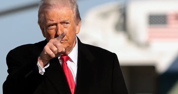 U.S. President Donald Trump gestures, before boarding Air Force One en route to Detroit, Michigan, at Joint Base Andrews, Maryland, U.S., January 13, 2026. REUTERS/Evelyn Hockstein/Evelyn Hockstein