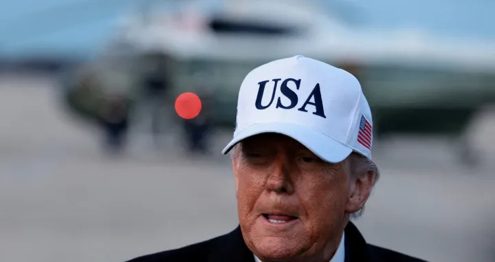 FILE PHOTO: U.S. President Donald Trump speaks to reporters, on his return from Detroit, Michigan, at Joint Base Andrews, Maryland, U.S., January 13, 2026. REUTERS/Evelyn Hockstein/File Photo/Evelyn Hockstein