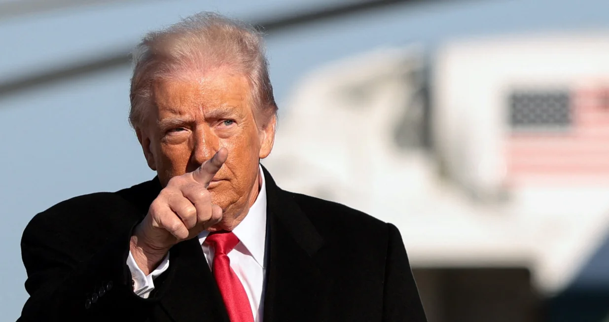 U.S. President Donald Trump gestures, before boarding Air Force One en route to Detroit, Michigan, at Joint Base Andrews, Maryland, U.S., January 13, 2026. REUTERS/Evelyn Hockstein/Evelyn Hockstein