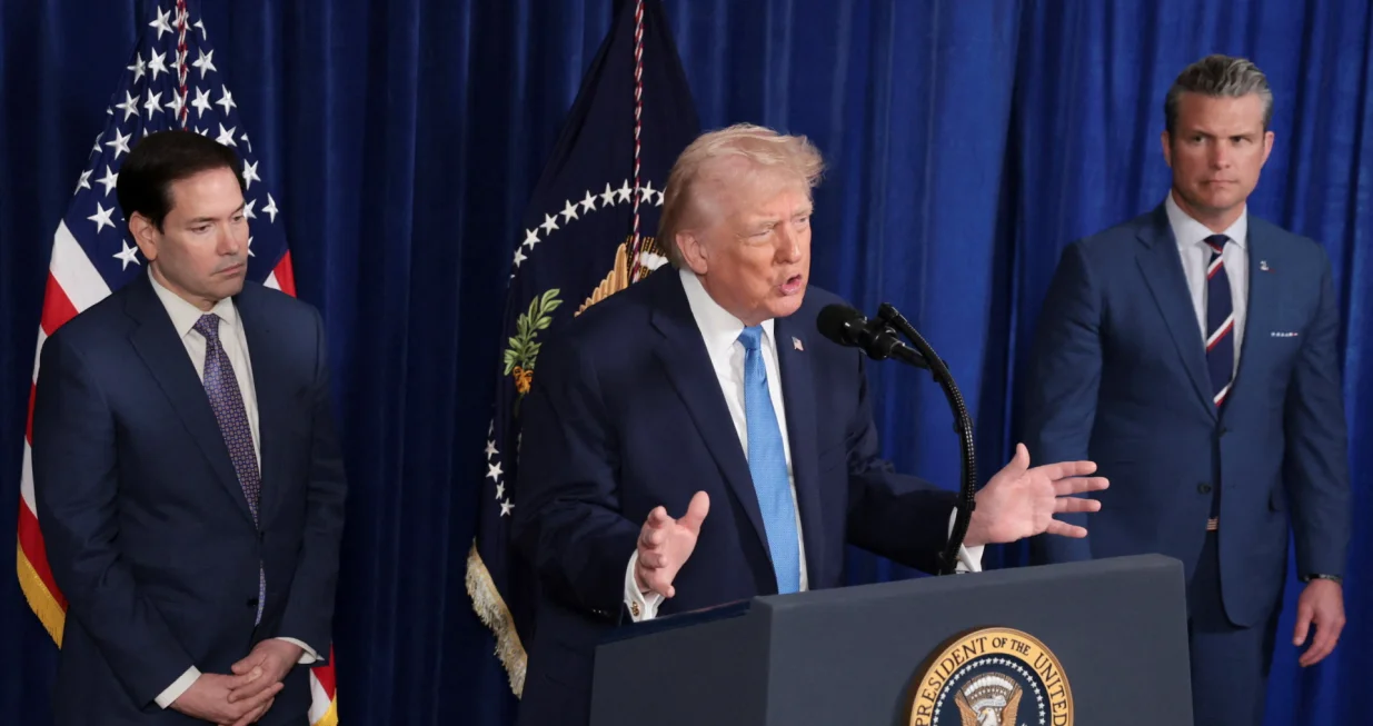U.S. President Donald Trump speaks as Secretary of Defense Pete Hegseth and U.S. Secretary of State Marco Rubio look on during a press conference following a U.S. strike on Venezuela where President Nicolas Maduro and his wife, Cilia Flores, were captured, from Trump's Mar-a-Lago club in Palm Beach, Florida, U.S., January 3, 2026. REUTERS/Jonathan Ernst/Jonathan Ernst