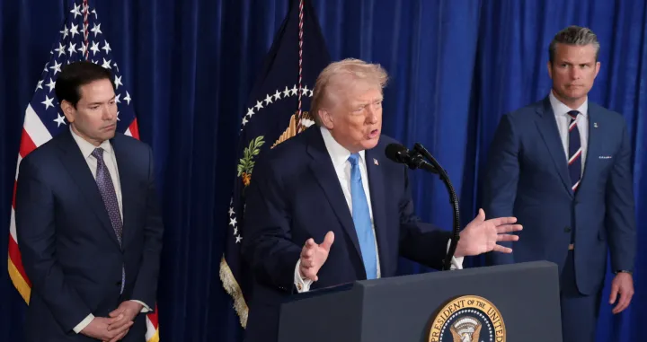 U.S. President Donald Trump speaks as Secretary of Defense Pete Hegseth and U.S. Secretary of State Marco Rubio look on during a press conference following a U.S. strike on Venezuela where President Nicolas Maduro and his wife, Cilia Flores, were captured, from Trump's Mar-a-Lago club in Palm Beach, Florida, U.S., January 3, 2026. REUTERS/Jonathan Ernst/Jonathan Ernst