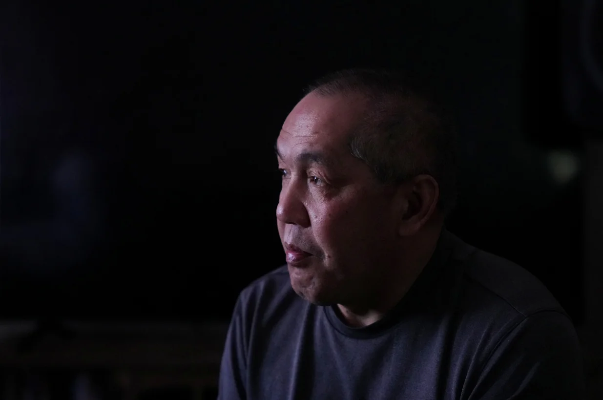 ChongLy Thao, who goes by Scott, during an interview with Reuters in his home a day after he was taken by U.S. Immigration and Customs Enforcement ICE agents and later returned in St Paul, Minnesota, U.S., January 19, 2026. Thao was taken by ICE agents after they broke down his door and was only returned some time later after they discovered they took the wrong person and that he is a U.S. citizen. REUTERS/Leah Millis/Leah Millis